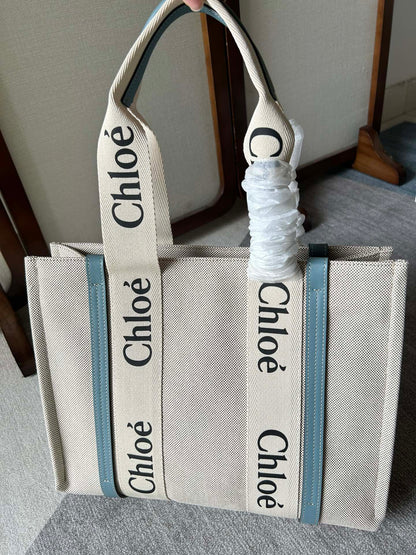 LAGRE WOODY TOTE BAG 45 IN BEIGE LINEN CANVAS BLACK WEBBING LOGO EMBROIDER BLUE CALFSKIN