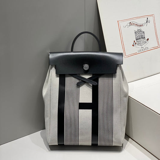 HERBAG A DOS ZIP RETOURNE BACKPACK 29 IN OFF-WHITE MIX BLACK CANVAS AND CALFSKIN
