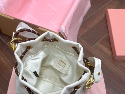 DRAWSTRING BUCKET BAG 21 IN WHITE CANVAS GOLD HARDWARE